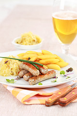 Image showing White sausage with sour cabbage