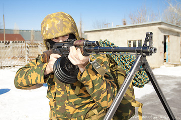 Image showing The military man with the weapon