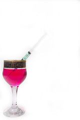 Image showing Syringe with poison in a glass