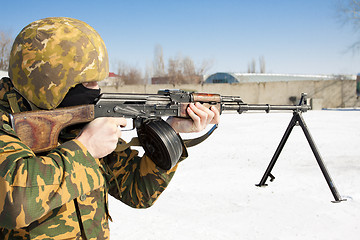 Image showing The military man with the weapon