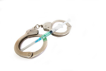 Image showing Handcuffs and syringe