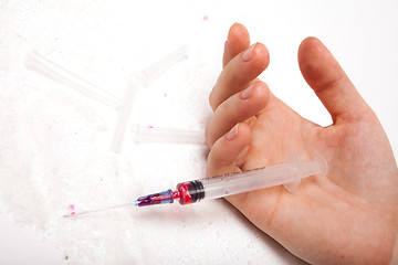 Image showing Syringe in a palm of the addict