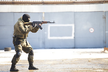 Image showing The military man with the weapon