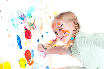 Image showing Little girl playing with colors