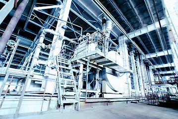 Image showing different size and shaped pipes and valves at a power plant 