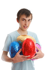 Image showing Boy holding 4 large easter eggs