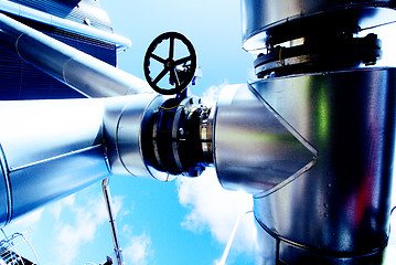 Image showing Industrial zone, Steel pipelines and valves against blue sky