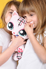 Image showing children with a toy plush cat