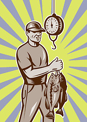 Image showing Fly Fisherman weighing in fish catch