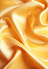 Image showing Smooth elegant golden satin as background 