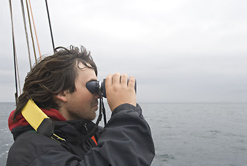 Image showing Sailor looking in binoculars