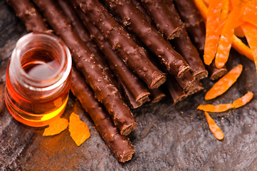 Image showing chocolate sticks with orange