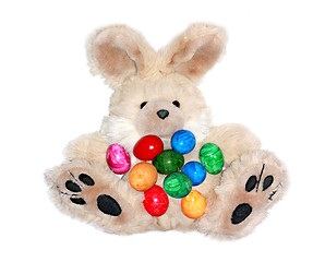 Image showing Easter bunny with lots of colorful eggs 