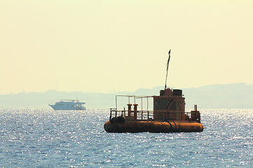 Image showing abandoned rusty ship at anchor