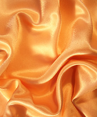 Image showing Smooth elegant golden silk as background