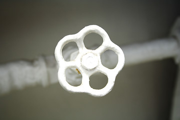 Image showing old white radiator valve close up