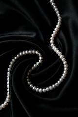 Image showing White pearls on the black velvet background 