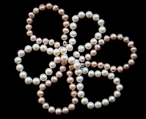 Image showing Flower of white and pink pearls on a black silk 