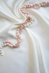 Image showing Elegant white silk with white and pink pearls 