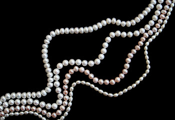 Image showing White and pink pearls on the black silk