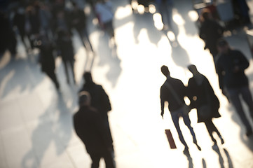 Image showing Shoppers in evening light with couple