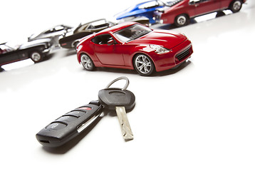 Image showing Car Keys and Several Sports Cars on White