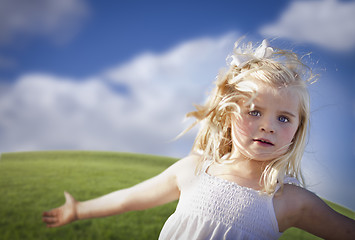 Image showing Adorable Blue Eyed Girl Playing Outside