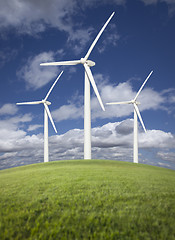 Image showing Wind Turbines Over Grass Field, Dramatic Sky and Clouds