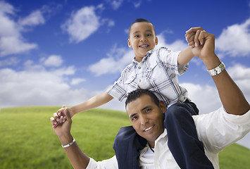 Image showing Hispanic Father and Son Having Fun Together