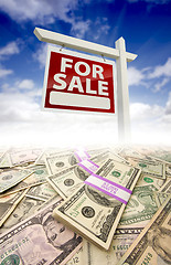 Image showing Stacks of Money and For Sale Real Estate Sign
