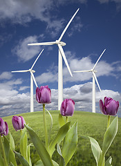 Image showing Wind Turbines Against Dramatic Sky, Clouds and Violets