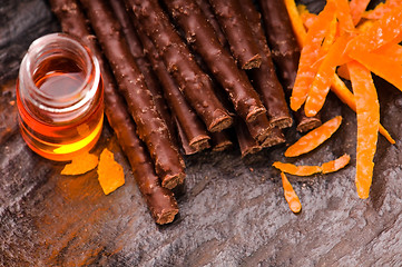 Image showing chocolate sticks with orange