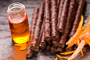 Image showing chocolate sticks with orange
