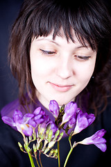 Image showing woman with purple flower