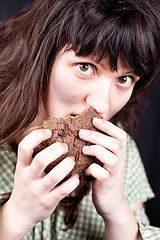 Image showing beggar woman eating bread 