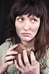 Image showing beggar woman with a piece of bread