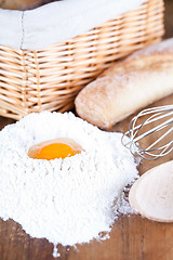 Image showing bread, eggs, whisk and flour