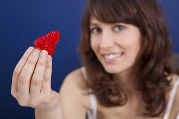 Image showing Eating strawberries