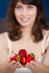 Image showing Eating strawberries