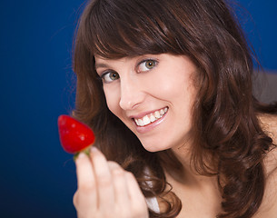 Image showing Eating strawberries