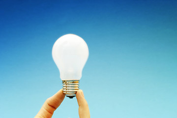 Image showing Background with lit lightbulb