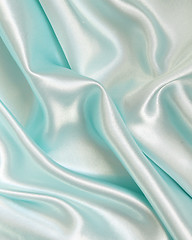 Image showing Smooth elegant blue silk as background 