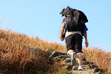 Image showing Sport hiking in mountains, walking and backpacking 