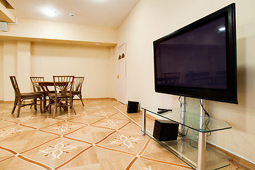 Image showing Lounge with TV, stereo and wicker furniture.