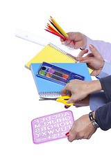 Image showing Hands holding education objects