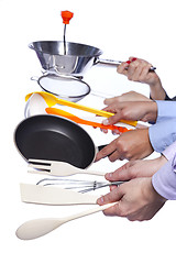 Image showing Hands holding kitchenware tools