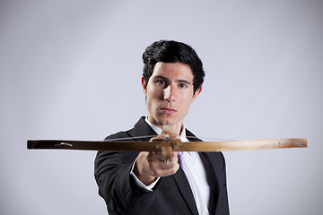 Image showing Businessman aiming with a Crossbow