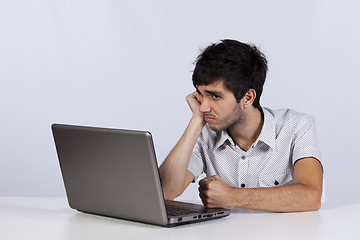 Image showing Young working with his laptop