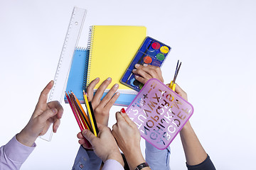 Image showing Hands holding education objects