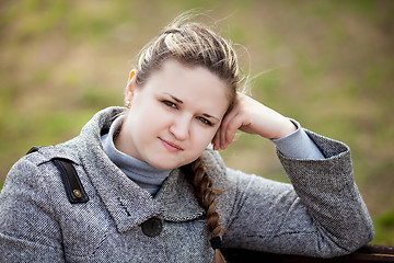 Image showing The girl longs on the nature